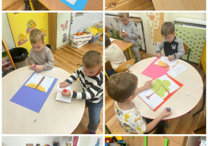 Dzieci z grupy „Złote Rybki” wykonują zadania związane z Dniem Drzewa.
