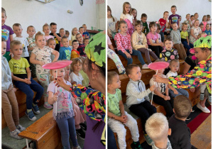 Klaun wręcza dzieciom siedzącym na widowni kręcące talerze plastikowe.