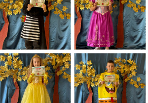 Dzieci przedszkolne z grupy Żabki z dyplomami znawcy bajek.