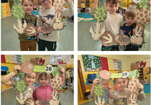 Dzieci z grupy Słoneczka w dinozaurowej fotobudce.