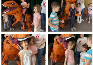 Dzieci z grupy Słoneczka bawią się z pomarańczowym dinozaurem.