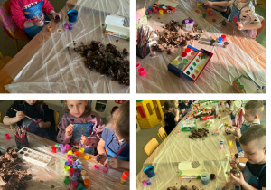 Dzieci z grupy Żabki podczas malowania farbami szyszek.