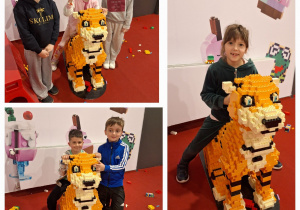 Uczniowie z klasy pierwszej z Sadykierza pozują do zdjęcia przy tygrysku wykonanym z lego.